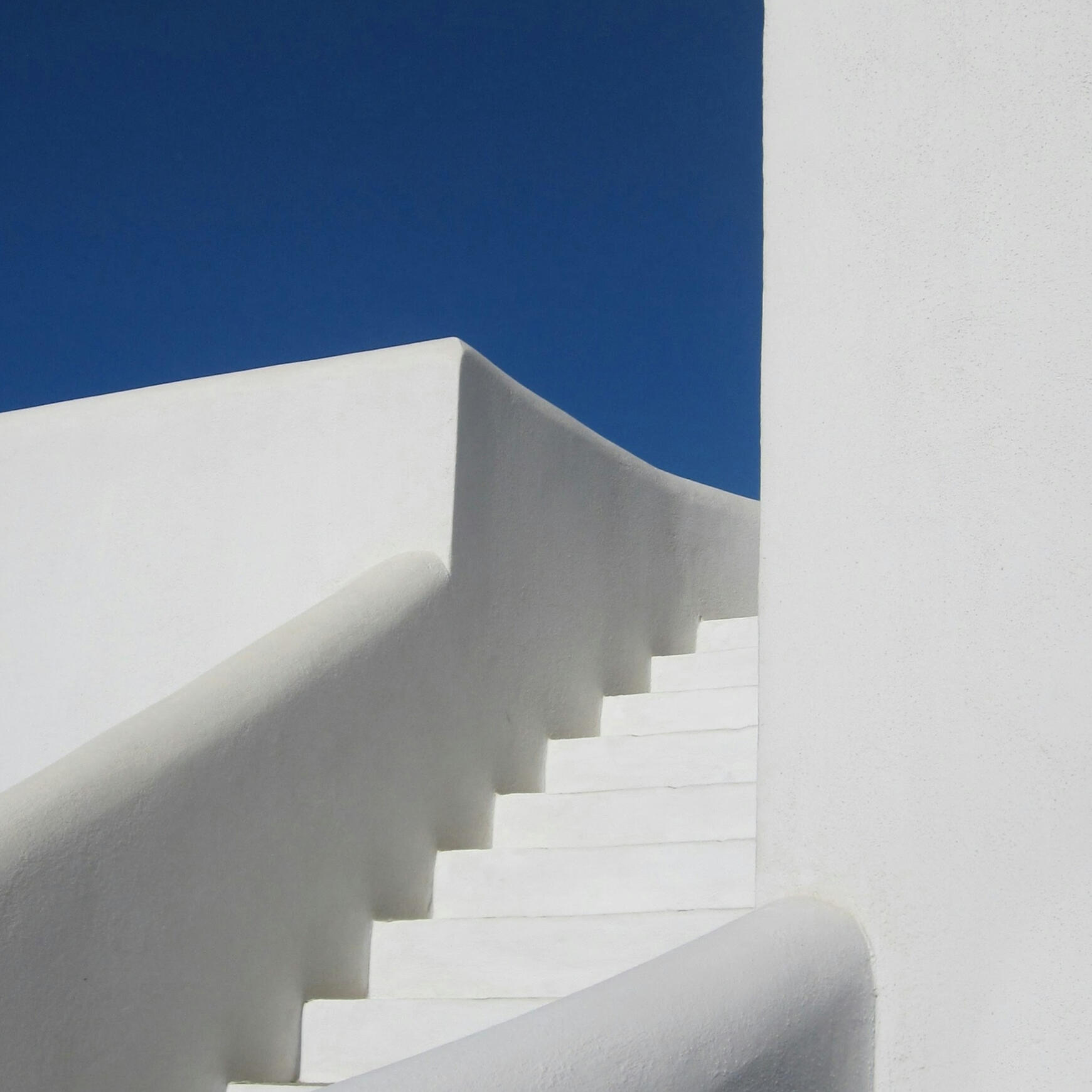 white stairs with a blue sky as the background