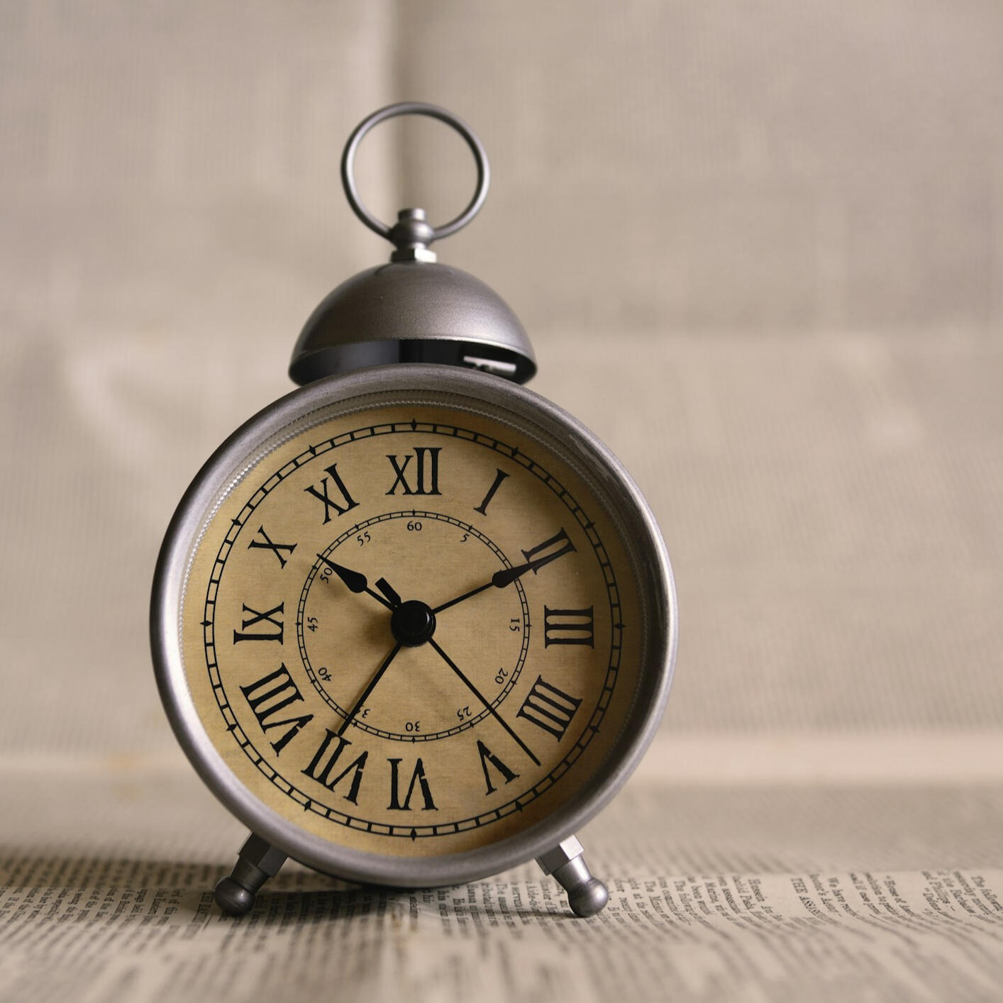 Photo by Ales Krivec on Unsplash a vintage looking clock on top of a book